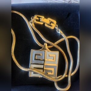 ***sold**1977 enamel, cream and white. Gold plated.